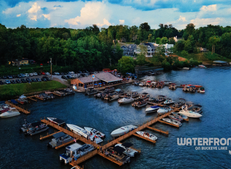 An aerial image of boats on the water at Buckeye Lake showing the front of the Waterfront on Buckeye Lake bar and restaurant.