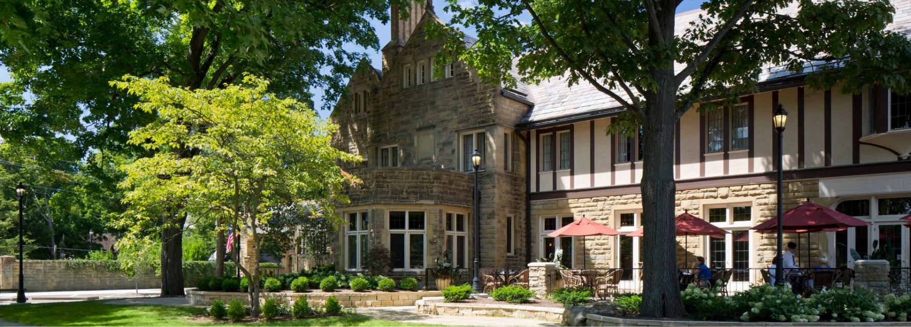 stone hotel with outdoor dining