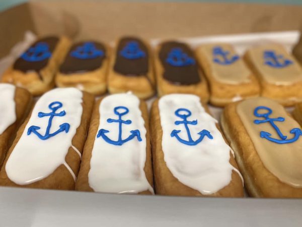 Photo of donuts with pirate ship hooks on them.