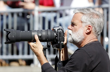 A man holding a camera.