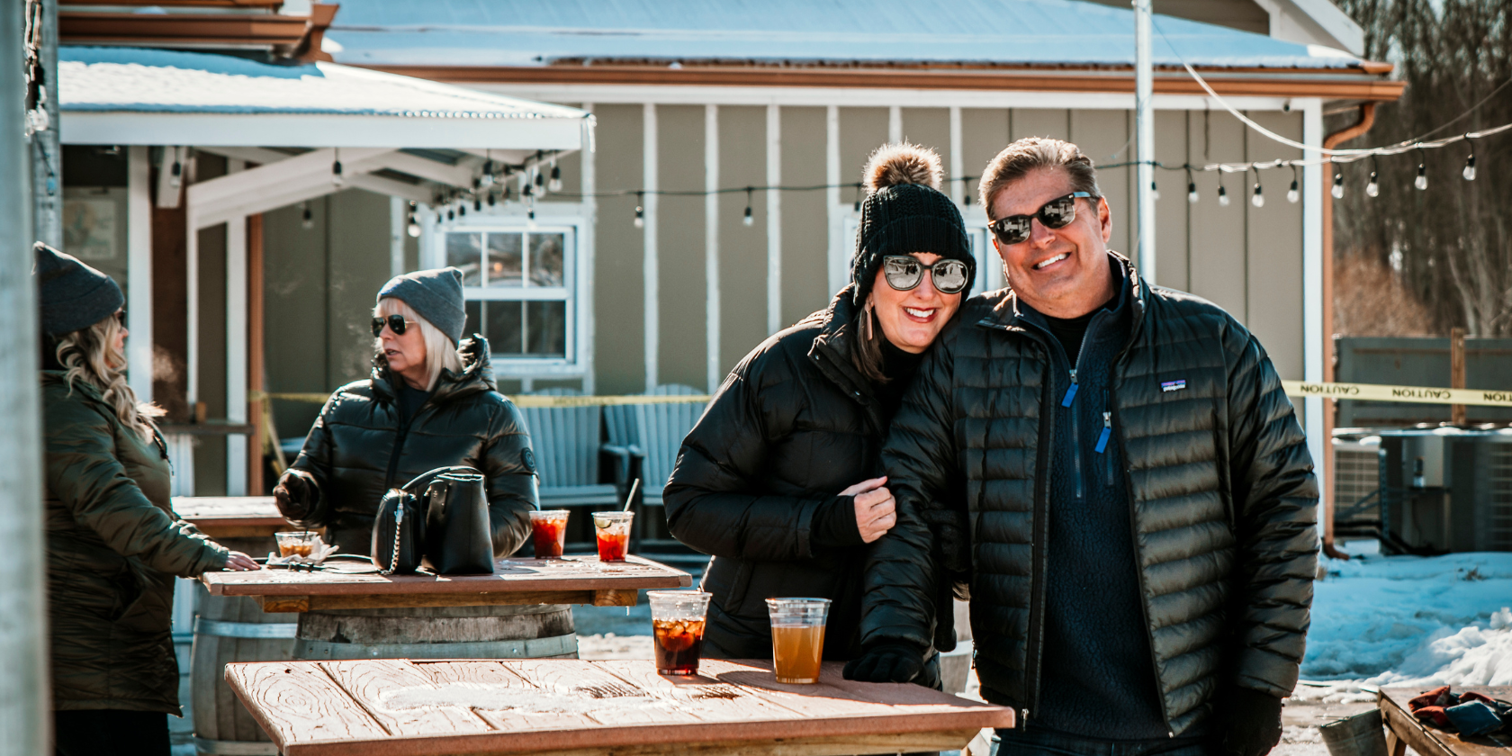 Photo of people gathered together with drinks at Buckeye Lake Winery