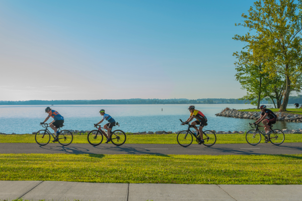 Photo of 4 people riding bikes along Buckeye Lake.