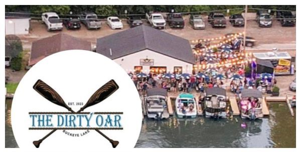 Photo of The Dirty Oar logo with the background picture being the back of the restaurant.