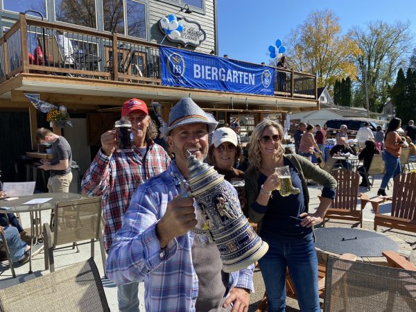 Photo of people posing with drinks during Oktoberfest at Horvath's Harbor.