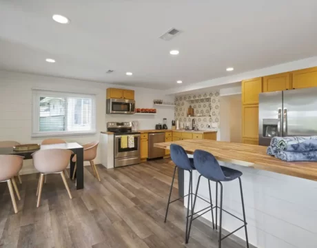 Picture of a kitchen and dining room at the Good Vibes Only rental.