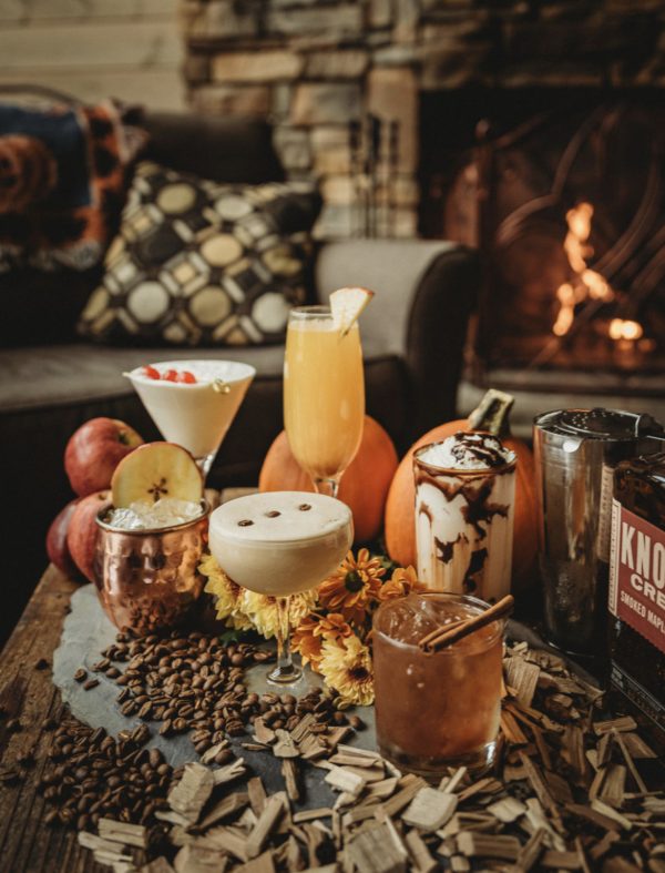 Photo of specialty Thanksgiving themed cocktails with fall themed decorations.