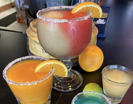 Photo of different sized and colored margaritas.