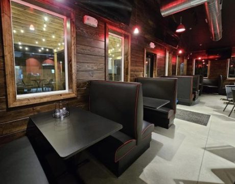 Indoor seating at a pizza restaurant.