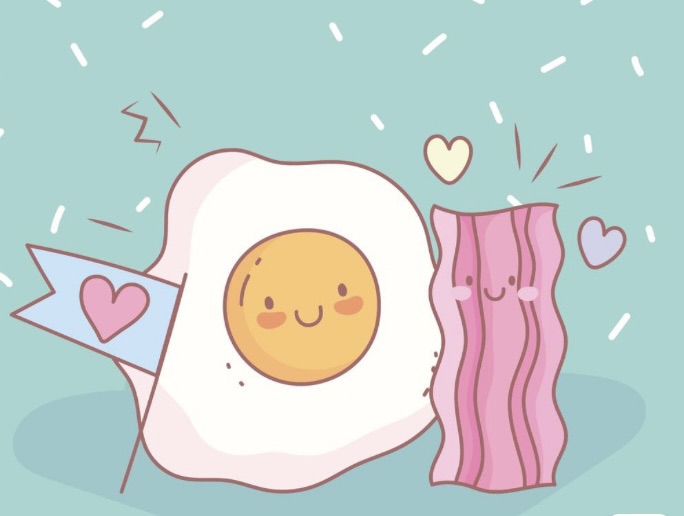 Photo of an animated egg and bacon with smiling faces