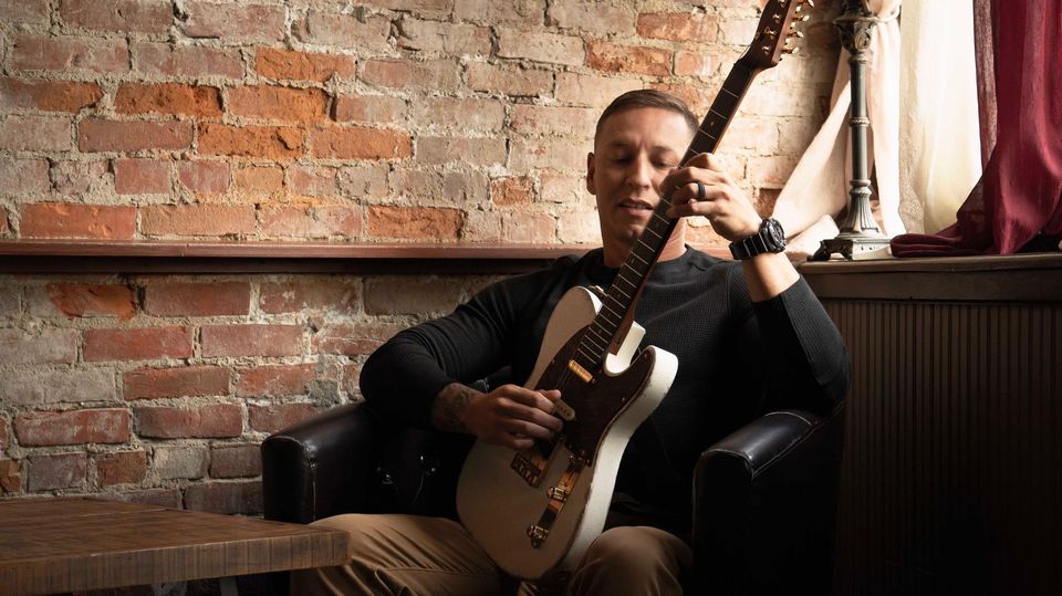 Photo of musician Justin Marchand playing guitar