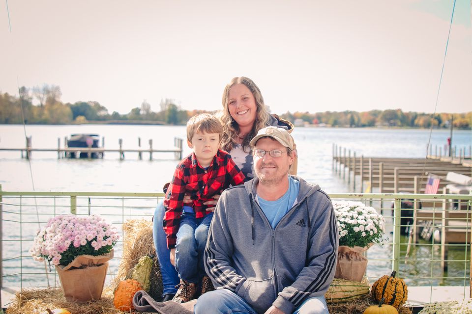 Photo of a family posed in front of Buckeye Lake