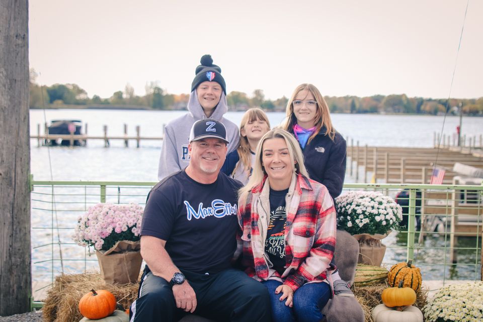 Photo of a family posed in front of Buckeye Lake