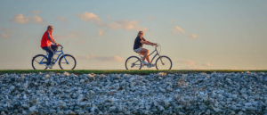 A couple ride their bikes on the bike path around Buckeye Lake.