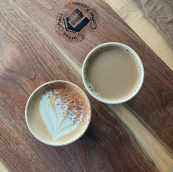 two coffee cups on a table